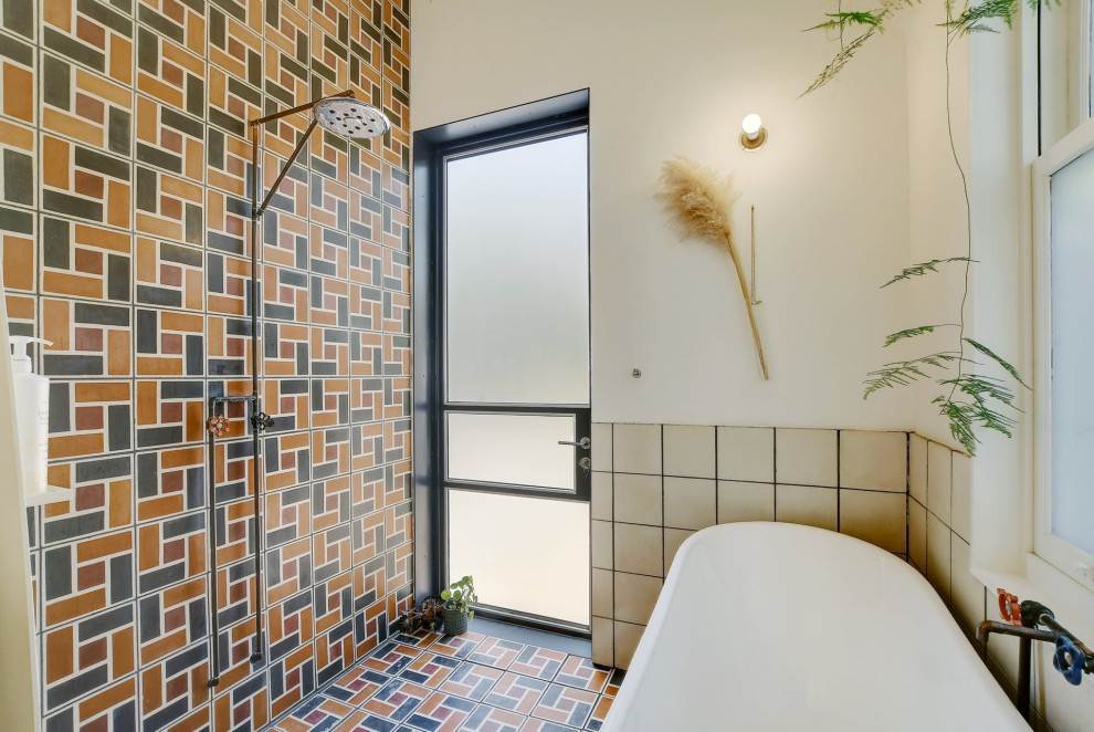 Inspiration for an industrial multicolored tile multicolored floor freestanding bathtub remodel in Austin with white walls
