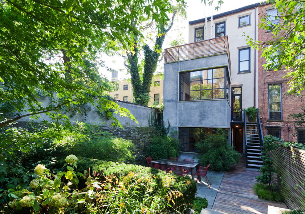 This is an example of a contemporary backyard garden in New York with decking.