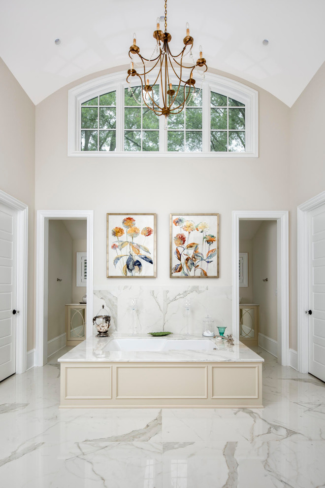 Design ideas for a large country master bathroom in Charlotte with raised-panel cabinets, beige cabinets, an undermount tub, an open shower, marble, beige walls, marble floors, marble benchtops, grey floor and an open shower.