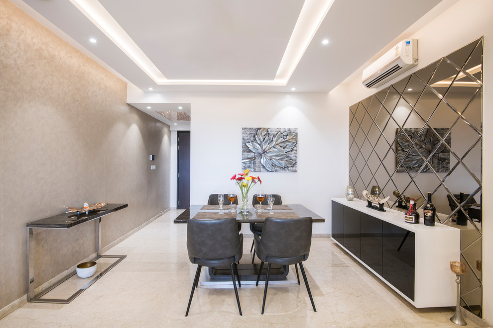 Inspiration for a contemporary separate dining room in Mumbai with white walls and beige floor.