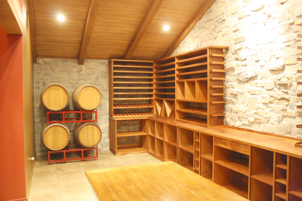 Design ideas for a large country wine cellar in Los Angeles with ceramic floors and storage racks.