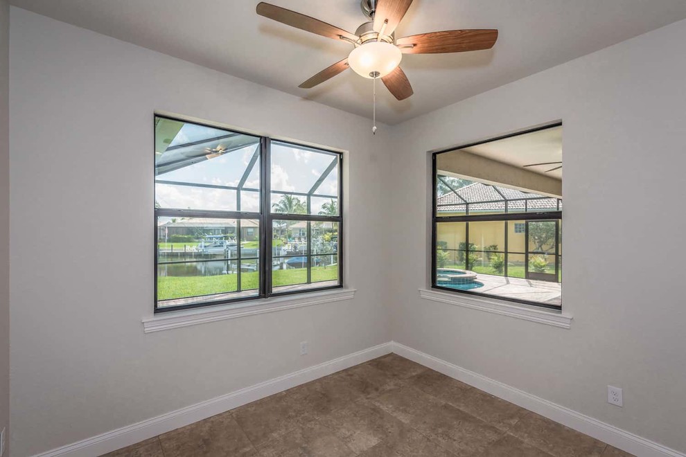 Example of a transitional home design design in Miami