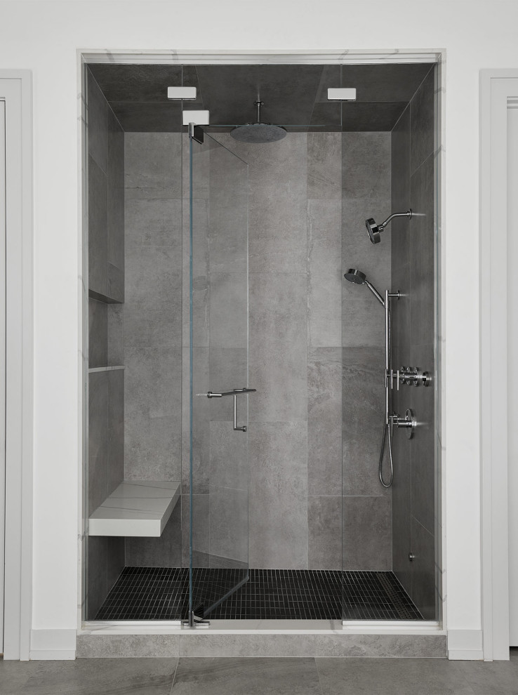 Example of a minimalist master gray tile and porcelain tile porcelain tile, gray floor and single-sink bathroom design in Chicago with flat-panel cabinets, light wood cabinets, white walls, quartz countertops, a hinged shower door, white countertops and a built-in vanity