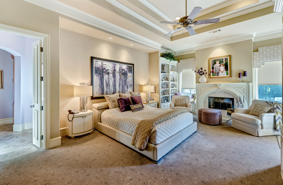 Design ideas for a traditional master bedroom in Dallas with beige walls and carpet.