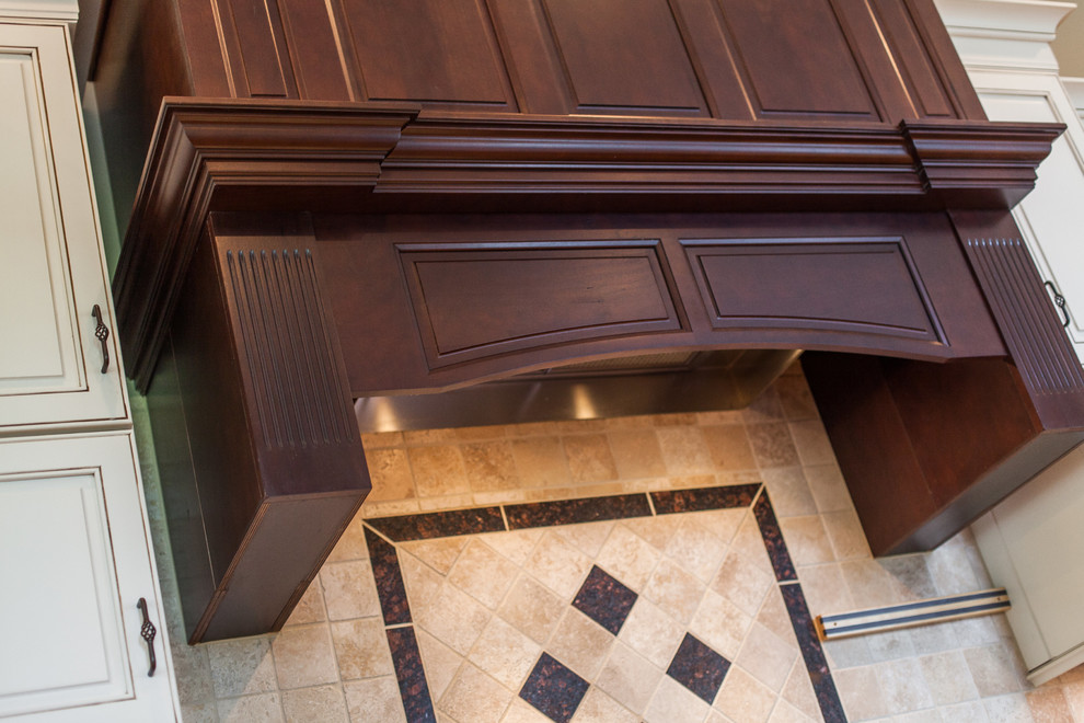 Inspiration for a huge transitional medium tone wood floor eat-in kitchen remodel in DC Metro with raised-panel cabinets, granite countertops, stainless steel appliances and an island