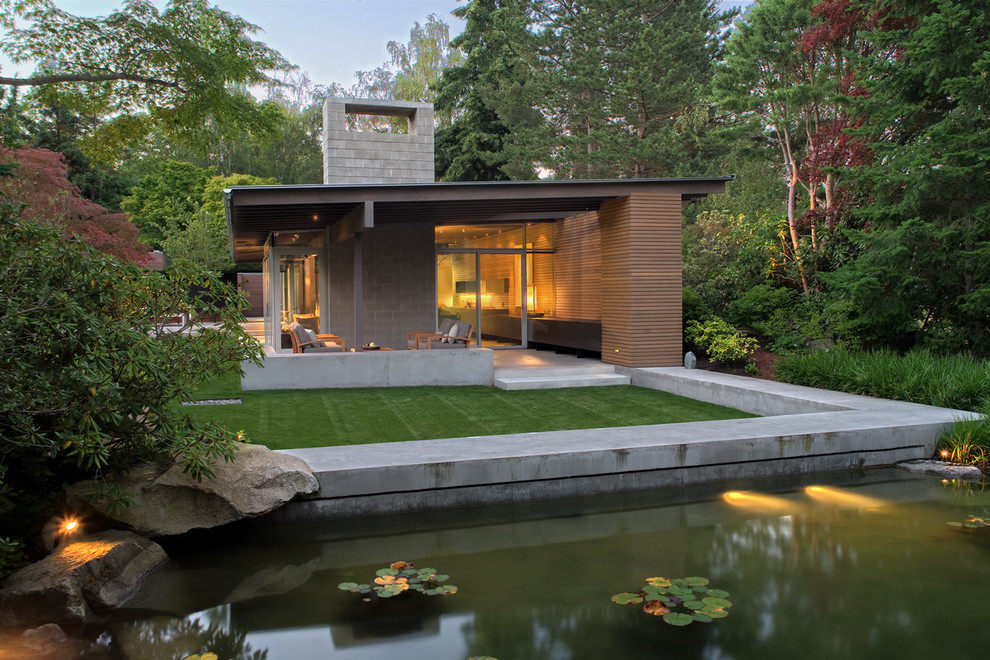 Contemporary exterior in Seattle with wood siding and a shed roof.