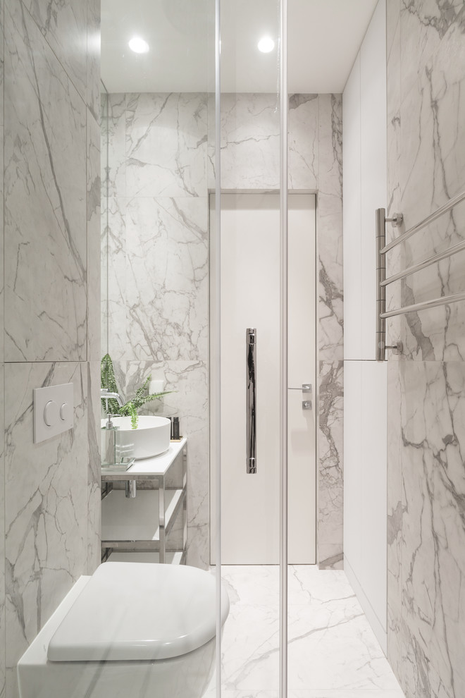 Design ideas for a contemporary 3/4 bathroom in Saint Petersburg with open cabinets, a two-piece toilet, gray tile, marble floors, a vessel sink and grey floor.