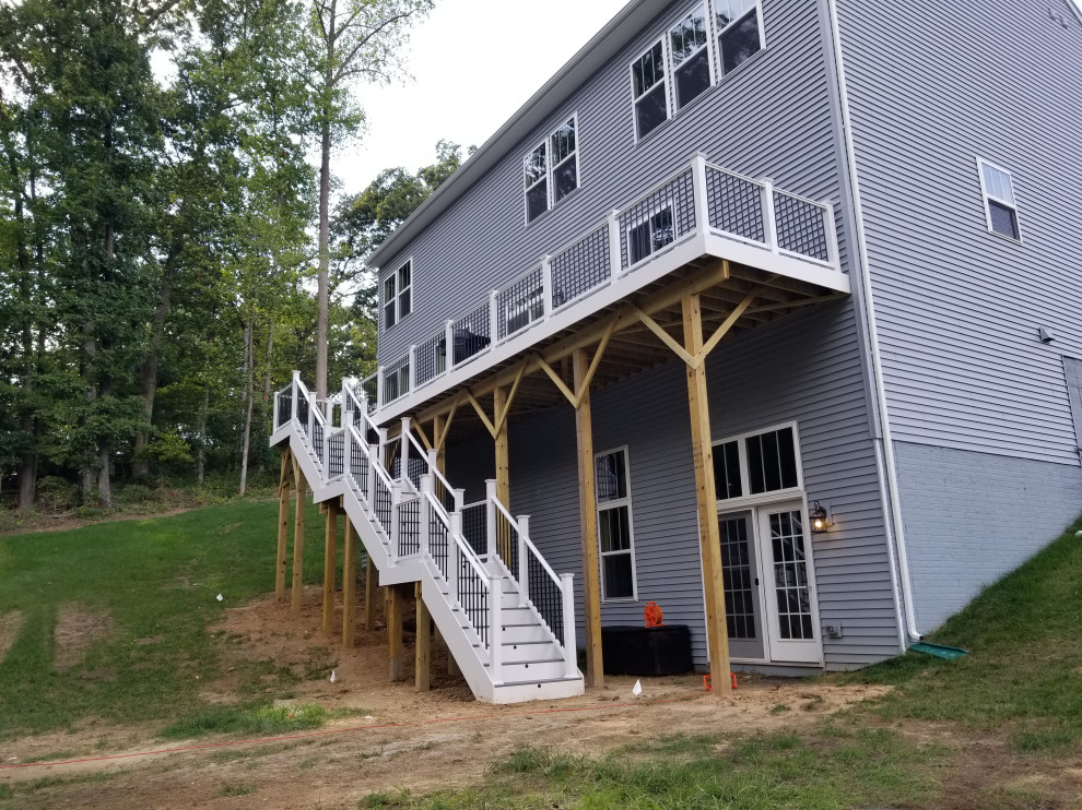 Inspiration for a large transitional backyard deck remodel