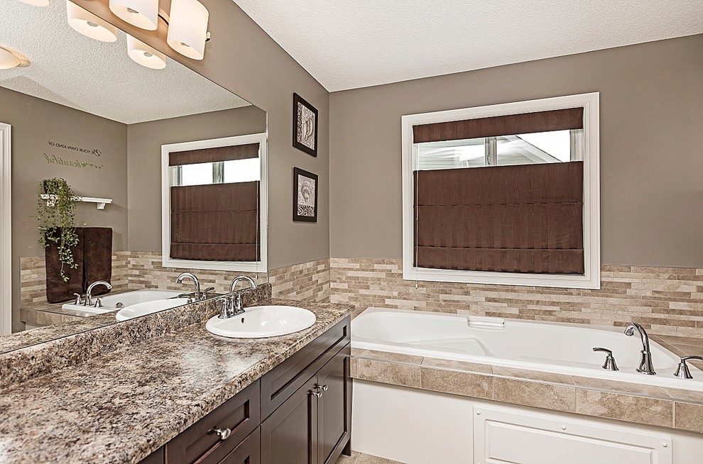 Transitional home design photo in Edmonton