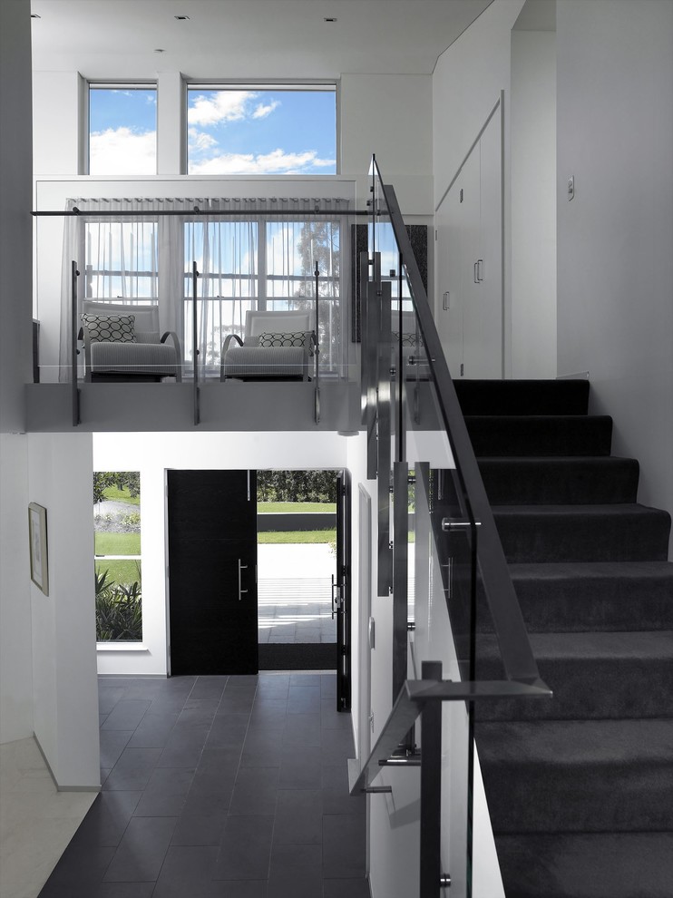 Photo of a contemporary entryway in Brisbane with a black front door.