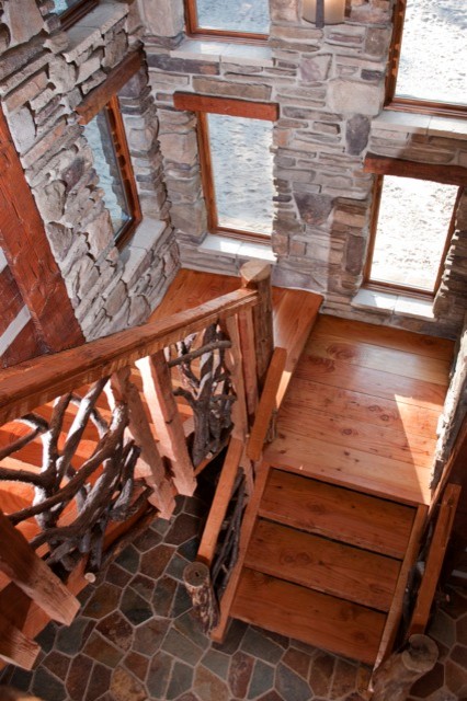 Large mountain style wooden l-shaped open staircase photo