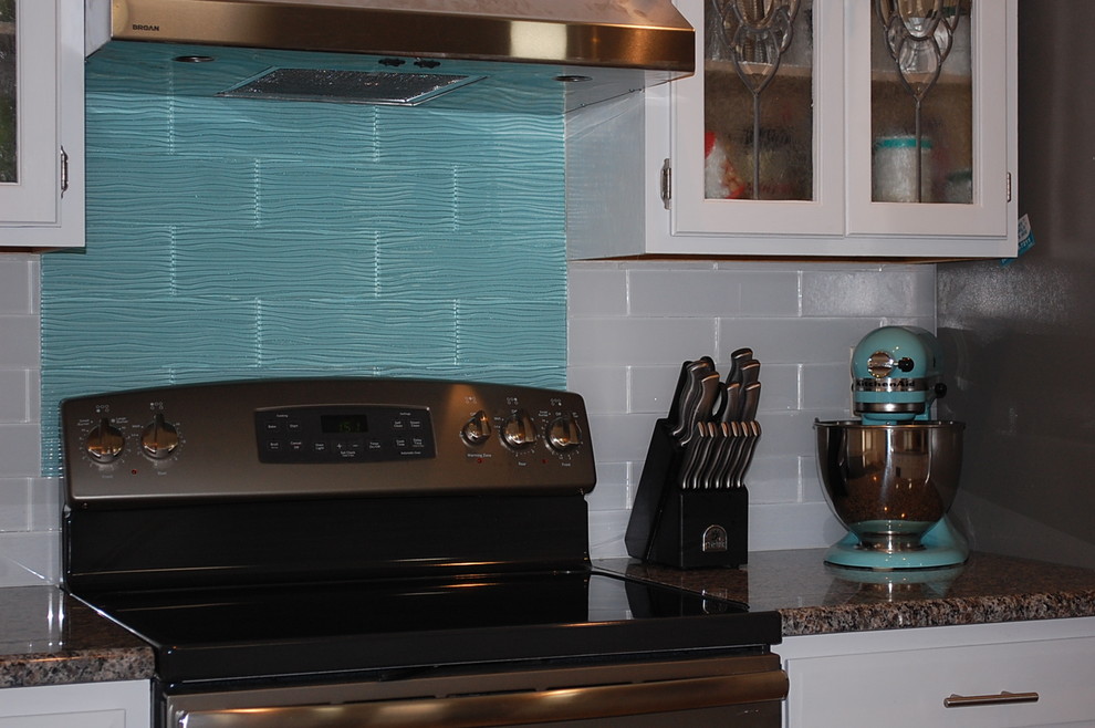 Inspiration for a transitional u-shaped kitchen remodel in Jacksonville with shaker cabinets, white cabinets and granite countertops