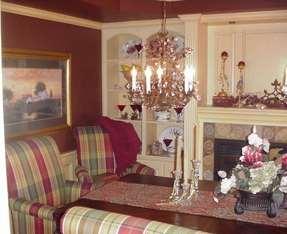 Photo of a traditional dining room in Cleveland with red walls.