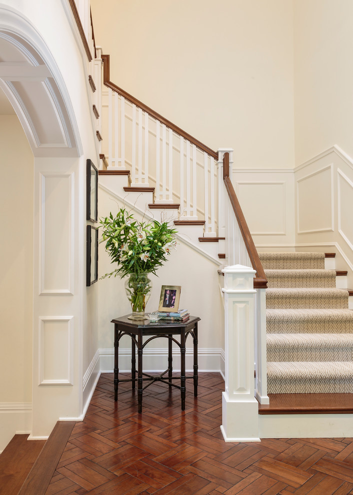 Mid-sized traditional wood l-shaped staircase in Orange County with painted wood risers.