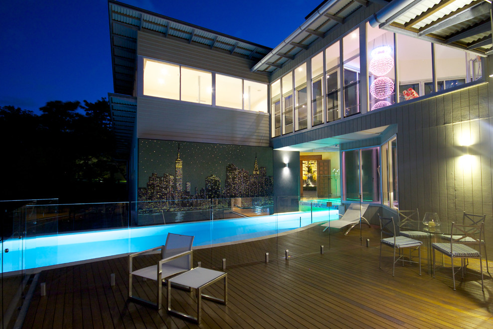 This is an example of a contemporary lap pool in Brisbane with decking.