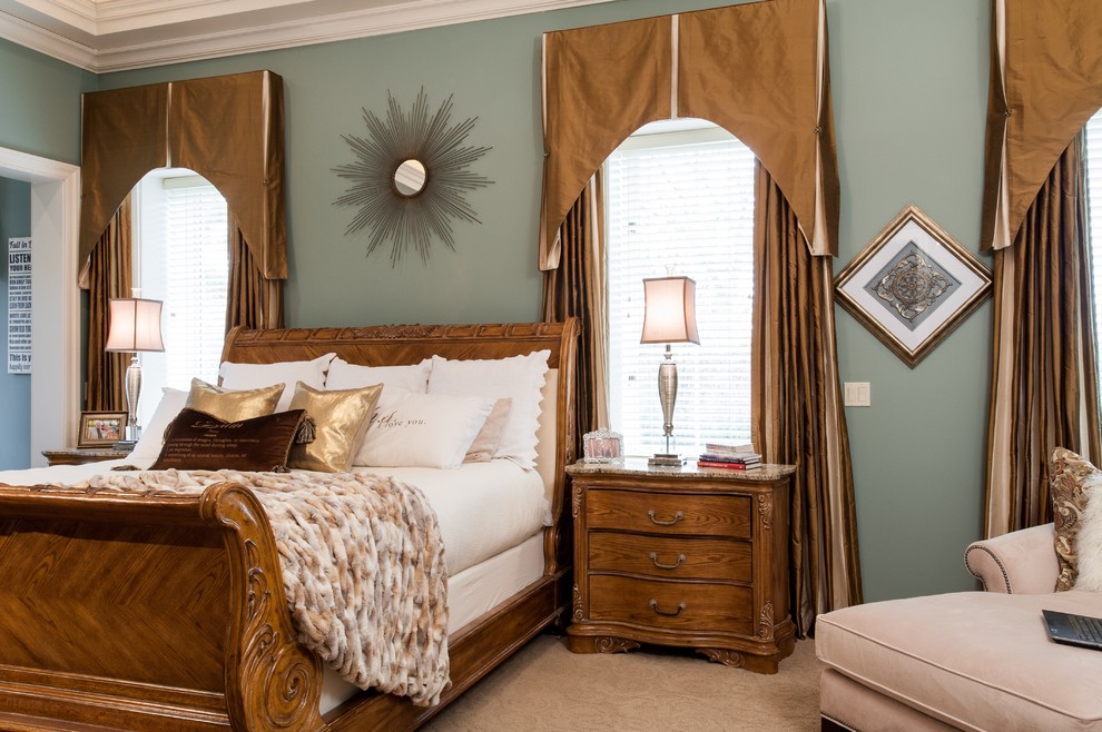 Inspiration for a large transitional master bedroom in St Louis with blue walls.
