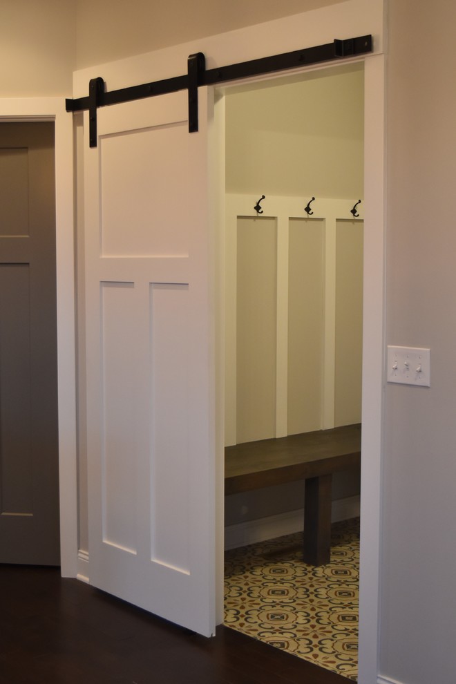 Inspiration for a mid-sized eclectic porcelain tile mudroom remodel