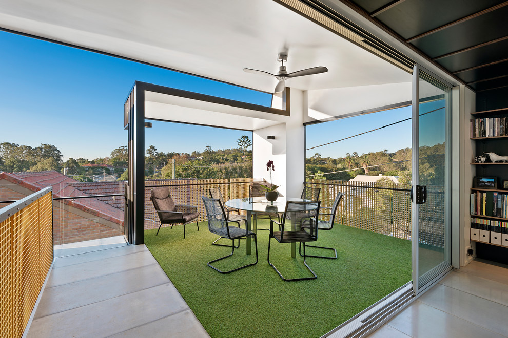 Design ideas for a small industrial balcony in Other with a roof extension.