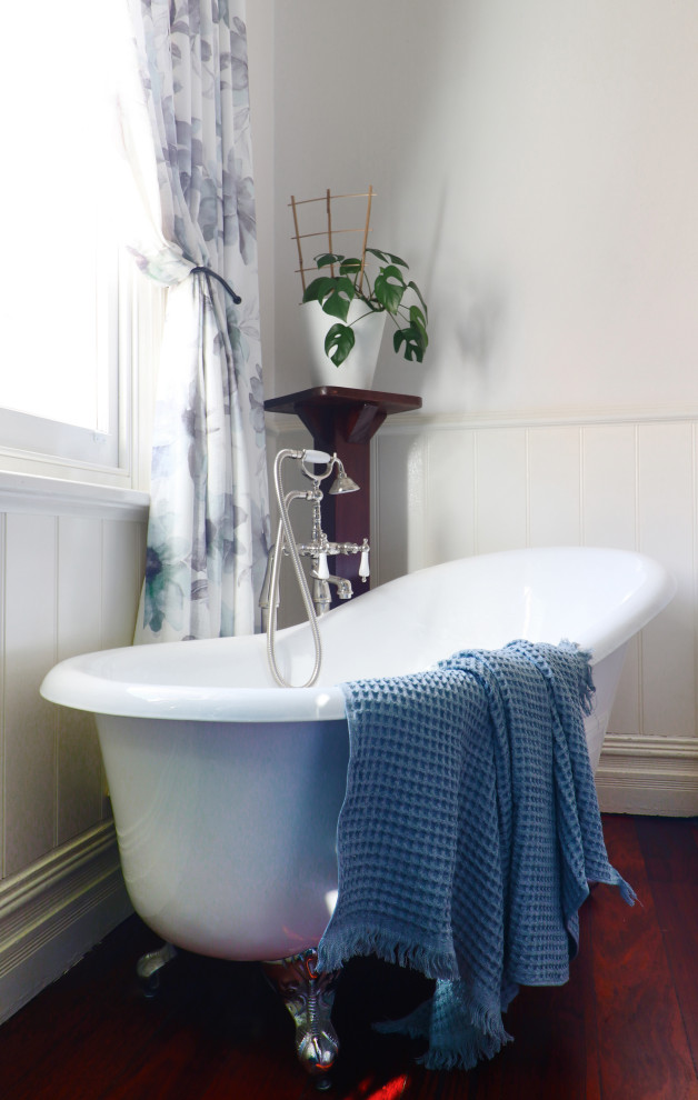Inspiration for a timeless kids' dark wood floor and wall paneling claw-foot bathtub remodel in Perth with white walls and a freestanding vanity