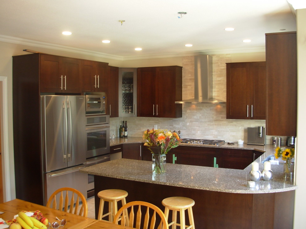 Mid-sized transitional u-shaped beige floor kitchen photo in Vancouver with a double-bowl sink, shaker cabinets, dark wood cabinets, quartz countertops, beige backsplash, porcelain backsplash, stainless steel appliances and a peninsula