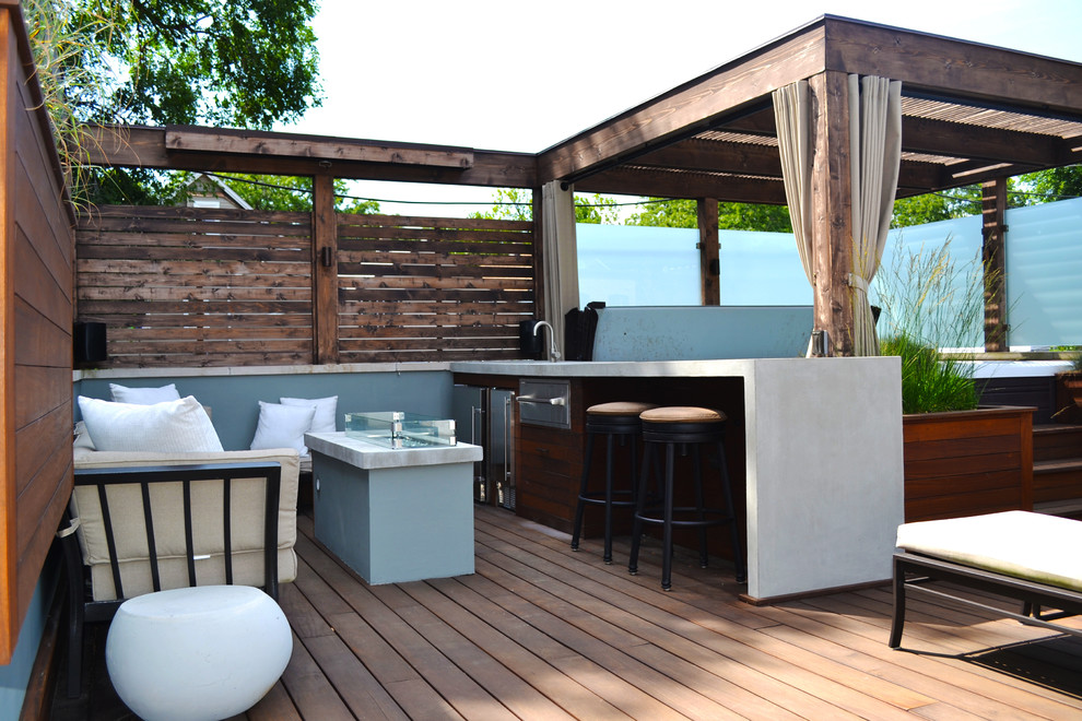 Inspiration for a small contemporary rooftop deck in Chicago with an outdoor kitchen and a pergola.