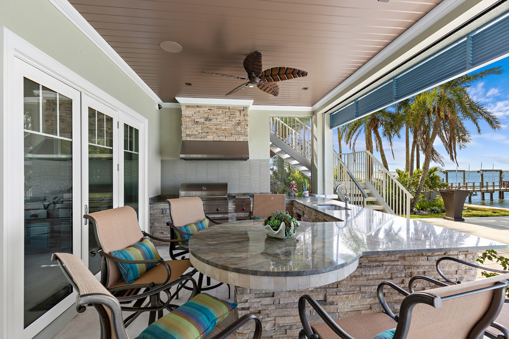 Beach style home design photo in Tampa