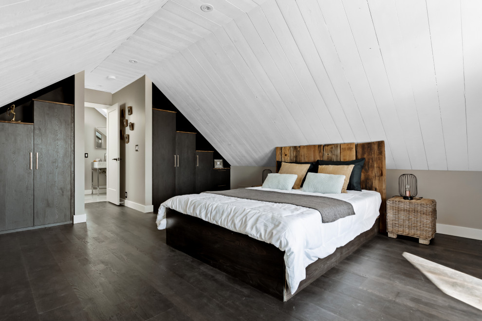 Large contemporary master bedroom in Montreal with white walls, dark hardwood floors, timber, vaulted and black floor.
