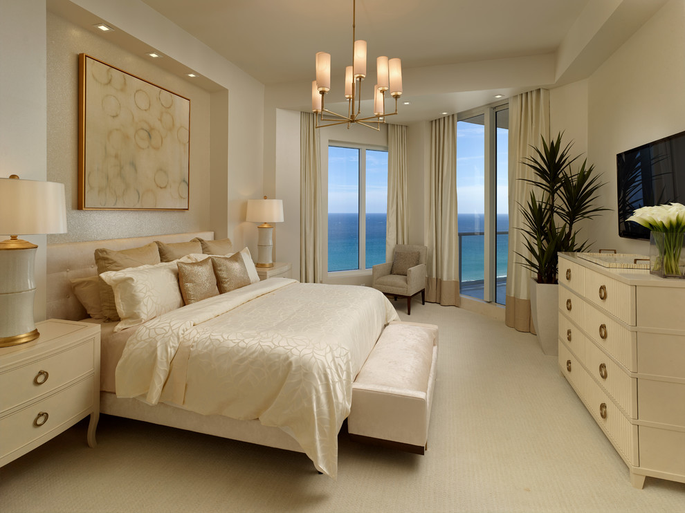 Inspiration for a mid-sized transitional master bedroom in Miami with beige walls and marble floors.