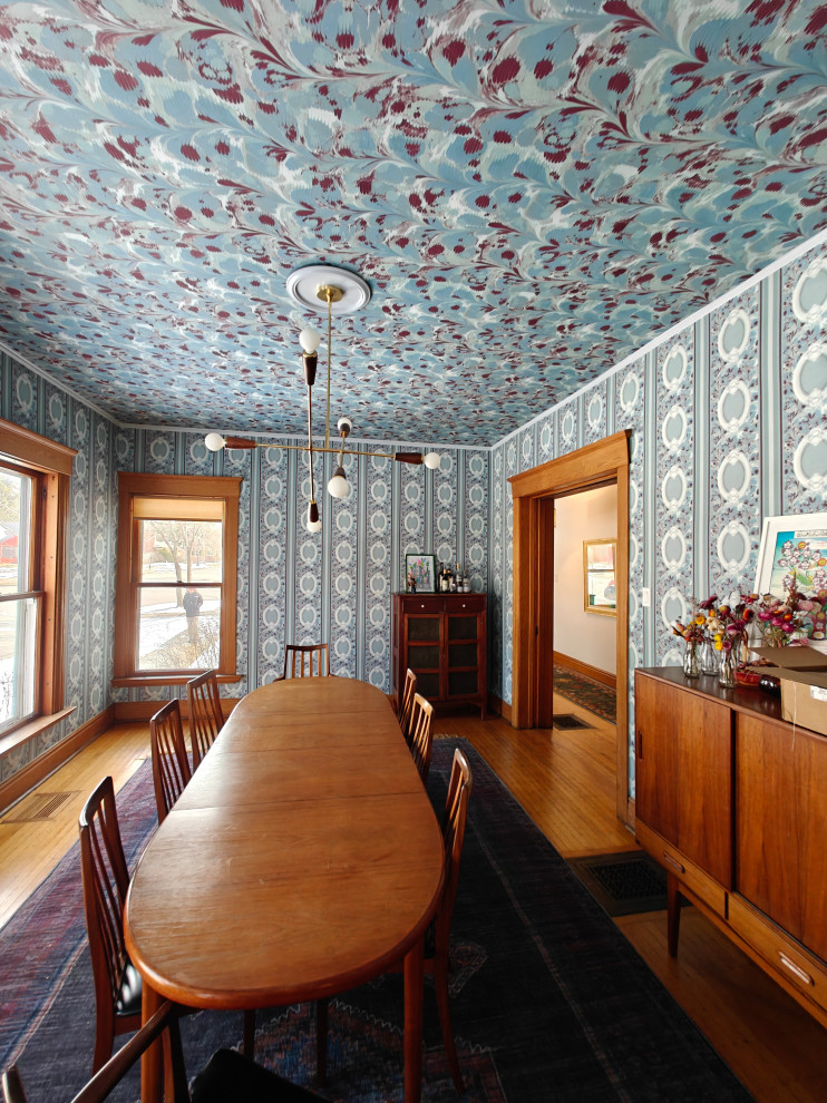Example of a mid-sized wallpaper ceiling and wallpaper dining room design in Chicago