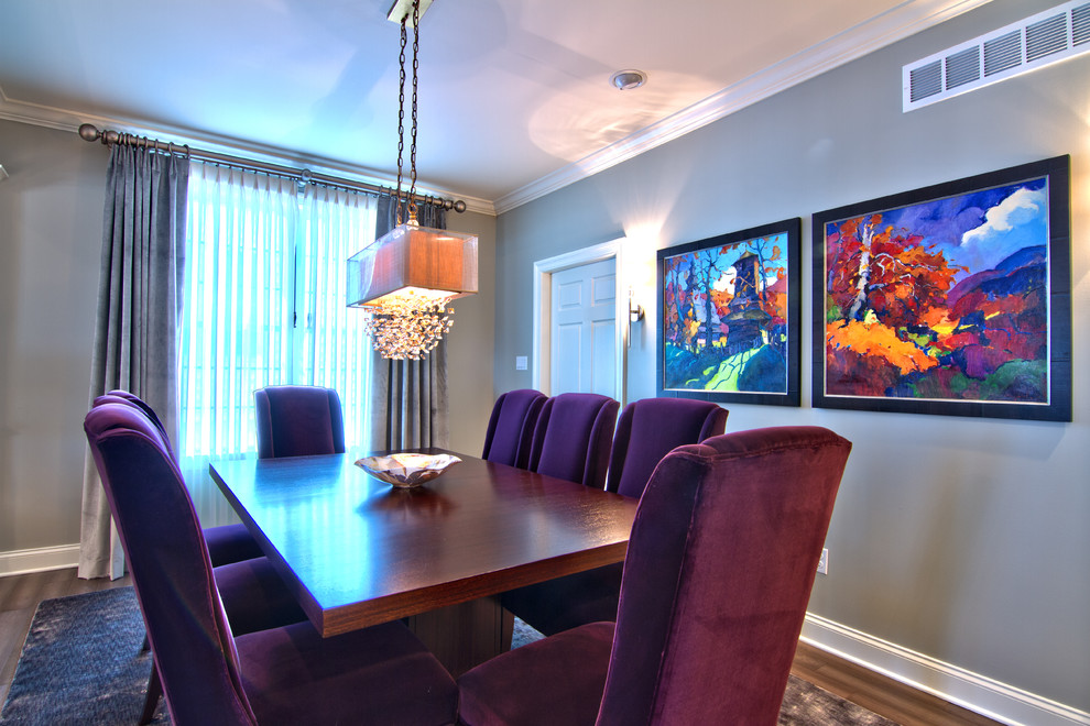 Transitional dark wood floor dining room photo with beige walls