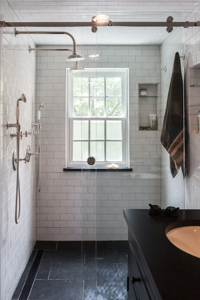 Inspiration for a large transitional master bathroom in Other with open cabinets, dark wood cabinets, a double shower, a two-piece toilet, white tile, ceramic tile, white walls, ceramic floors, an undermount sink, granite benchtops, black floor and a sliding shower screen.