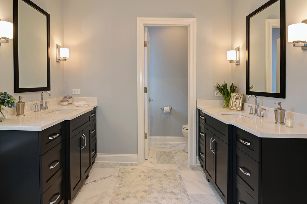 Doorless shower - mid-sized transitional master stone tile marble floor doorless shower idea in Chicago with recessed-panel cabinets, dark wood cabinets, gray walls, an undermount sink and quartz countertops