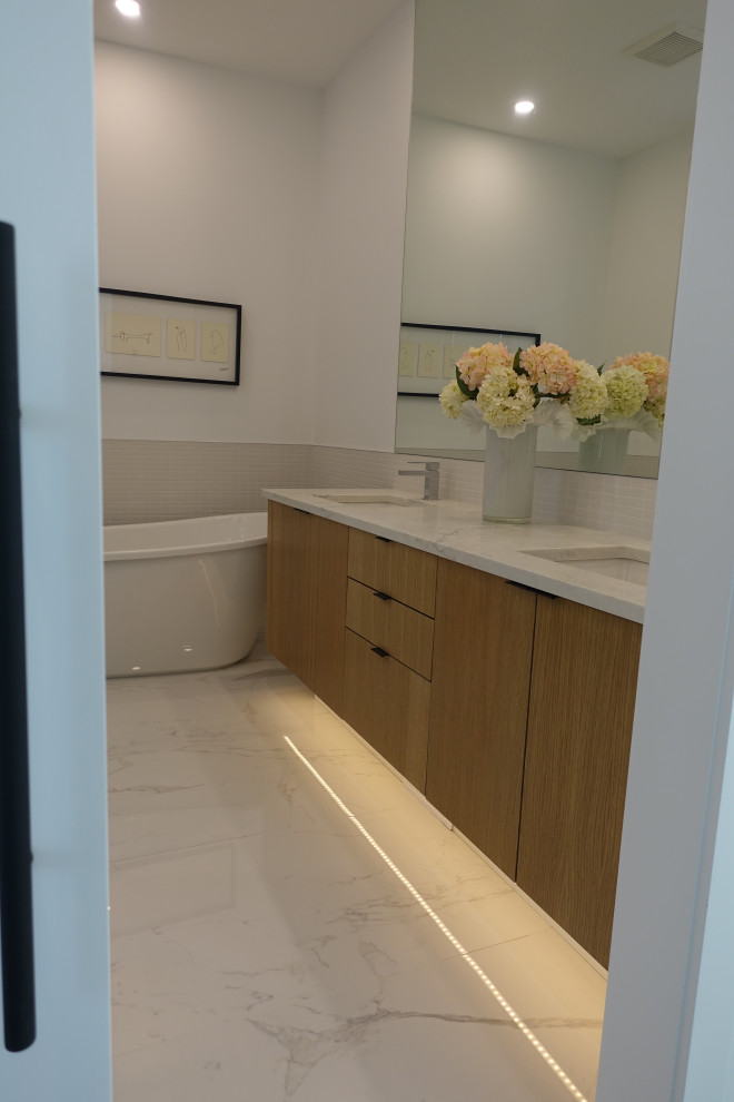 Example of a transitional home design design in Calgary