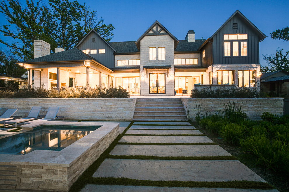 Inspiration for a large eclectic gray two-story gable roof remodel in Dallas