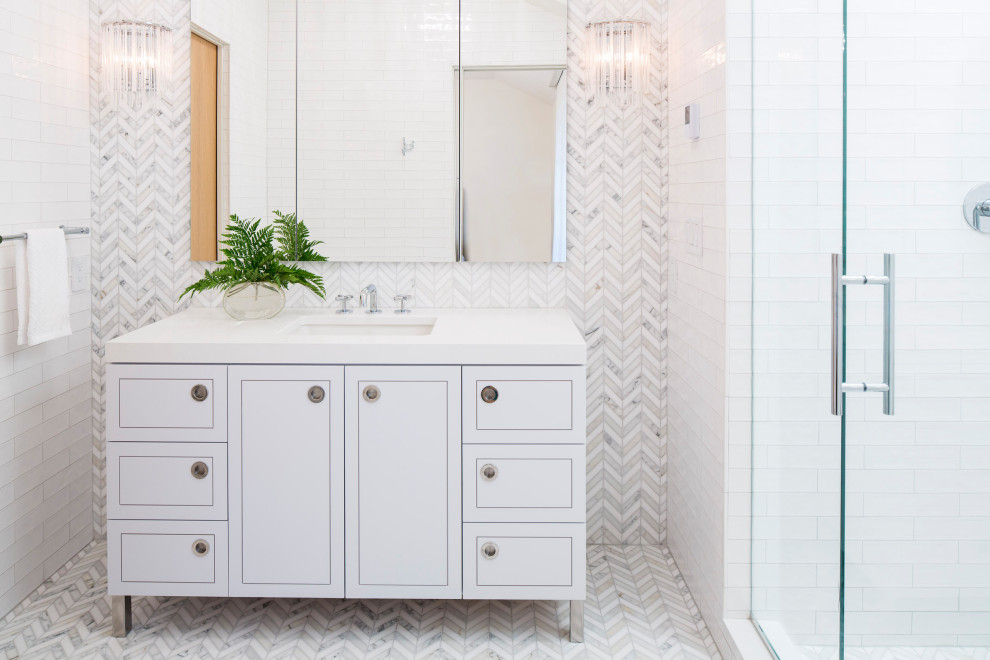 Medium sized modern shower room bathroom in Minneapolis with flat-panel cabinets, white cabinets, an alcove shower, white tiles, stone tiles, white walls, marble flooring, a submerged sink, granite worktops, grey floors, a hinged door, white worktops, a single sink and a freestanding vanity unit.