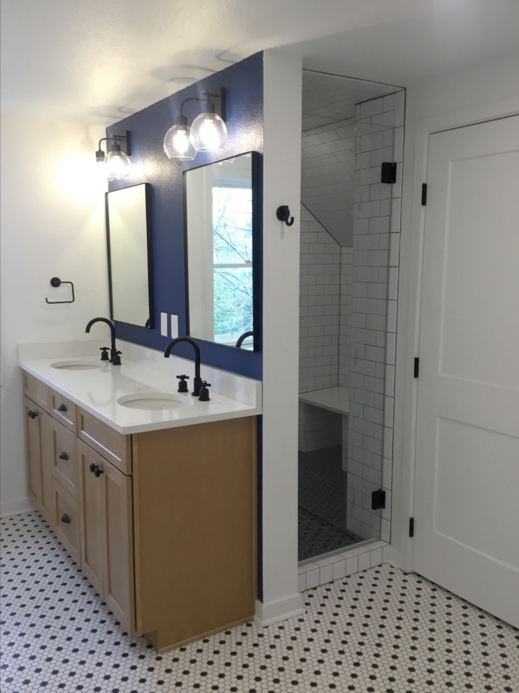 Photo of a mid-sized arts and crafts master bathroom in Denver with recessed-panel cabinets, light wood cabinets, a two-piece toilet, subway tile, white walls, mosaic tile floors, an undermount sink, engineered quartz benchtops, white floor, a hinged shower door, white benchtops, a laundry, a double vanity and a freestanding vanity.