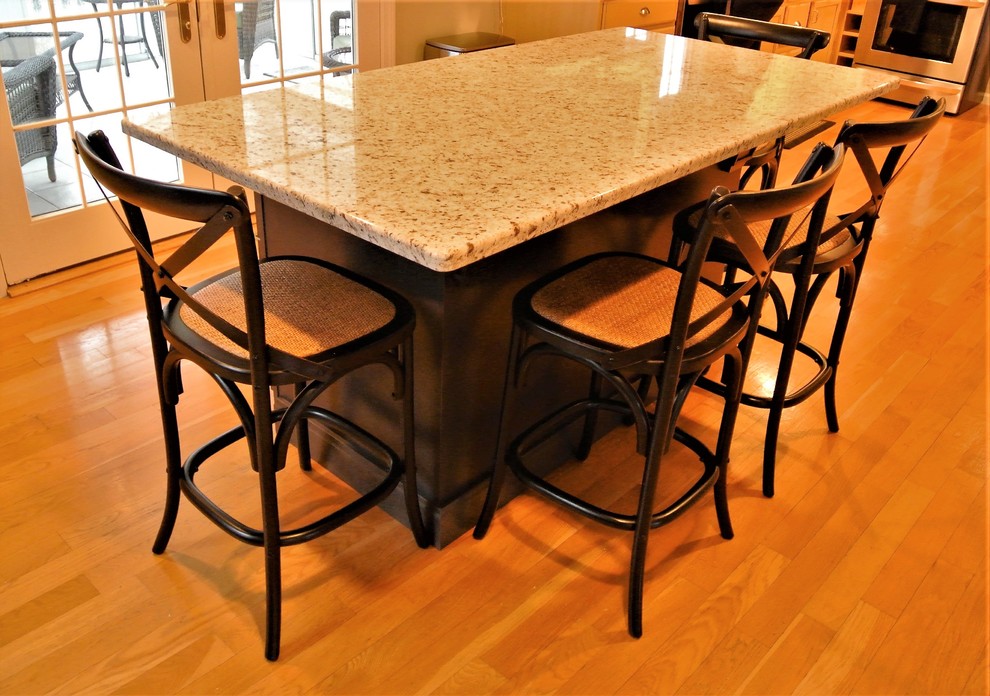 Transitional light wood floor eat-in kitchen photo in Boston with granite countertops and an island