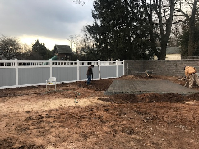 Fence installation after patio and retaining wall