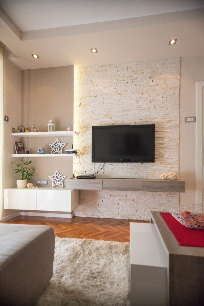 Inspiration for a contemporary living room in Other with beige walls, medium hardwood floors and a wall-mounted tv.