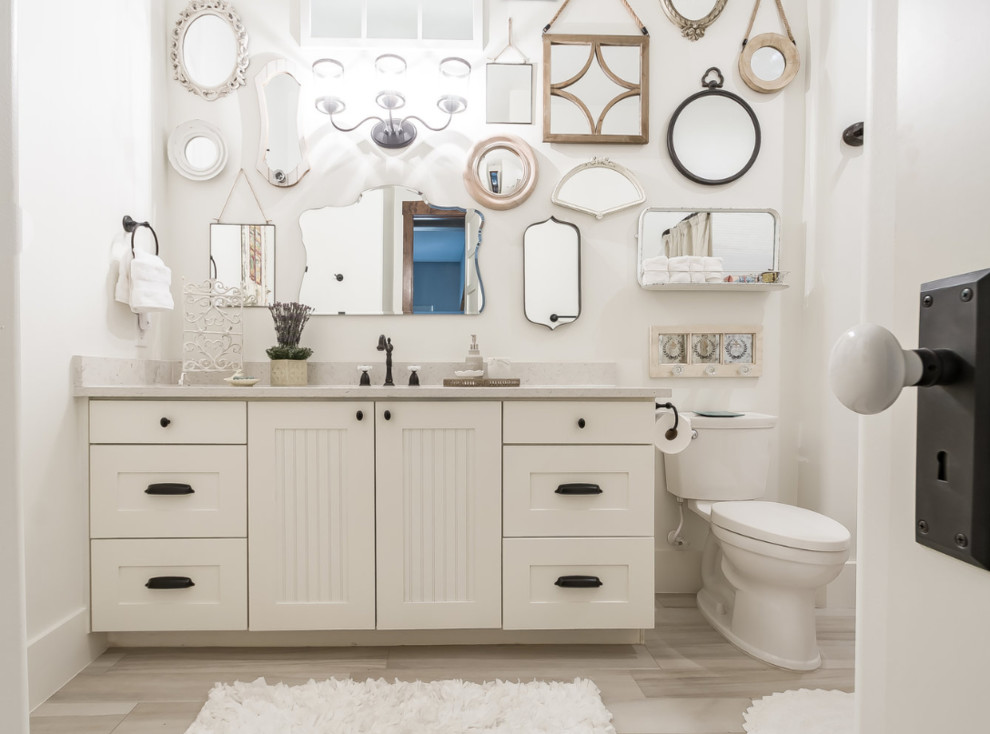 Inspiration for a large modern master bathroom in Dallas with shaker cabinets, white cabinets, an alcove tub, a shower/bathtub combo, a two-piece toilet, white walls, wood-look tile, an undermount sink, granite benchtops, multi-coloured floor, a shower curtain, grey benchtops, a single vanity, a built-in vanity and vaulted.