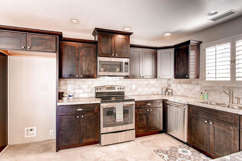 Example of a mid-sized trendy u-shaped porcelain tile and beige floor eat-in kitchen design in Los Angeles with an undermount sink, shaker cabinets, dark wood cabinets, granite countertops, gray backsplash, terra-cotta backsplash, stainless steel appliances and an island