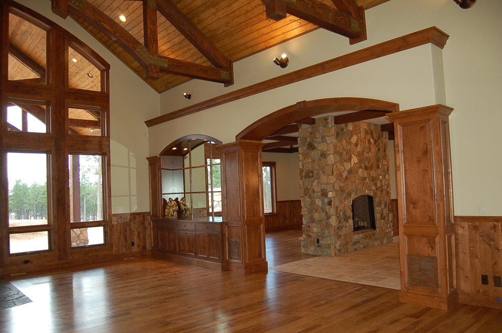 Foyer - mid-sized rustic medium tone wood floor foyer idea in Denver with beige walls