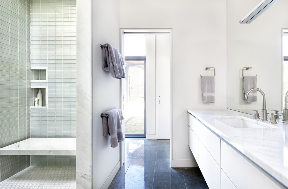 Design ideas for a modern bathroom in Austin with glass tile, an open shower and an open shower.