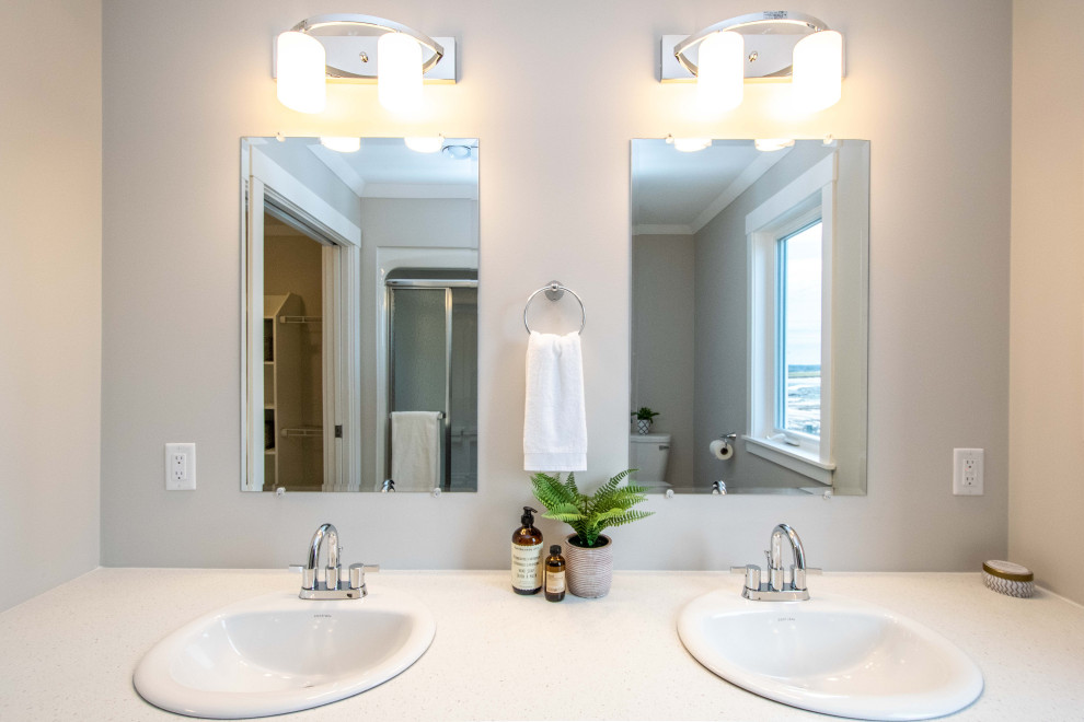 Mid-sized beach style master bathroom in Other with shaker cabinets, grey cabinets, an alcove tub, an alcove shower, beige walls, vinyl floors, a drop-in sink, laminate benchtops, grey floor, a shower curtain, white benchtops, a single vanity and a built-in vanity.