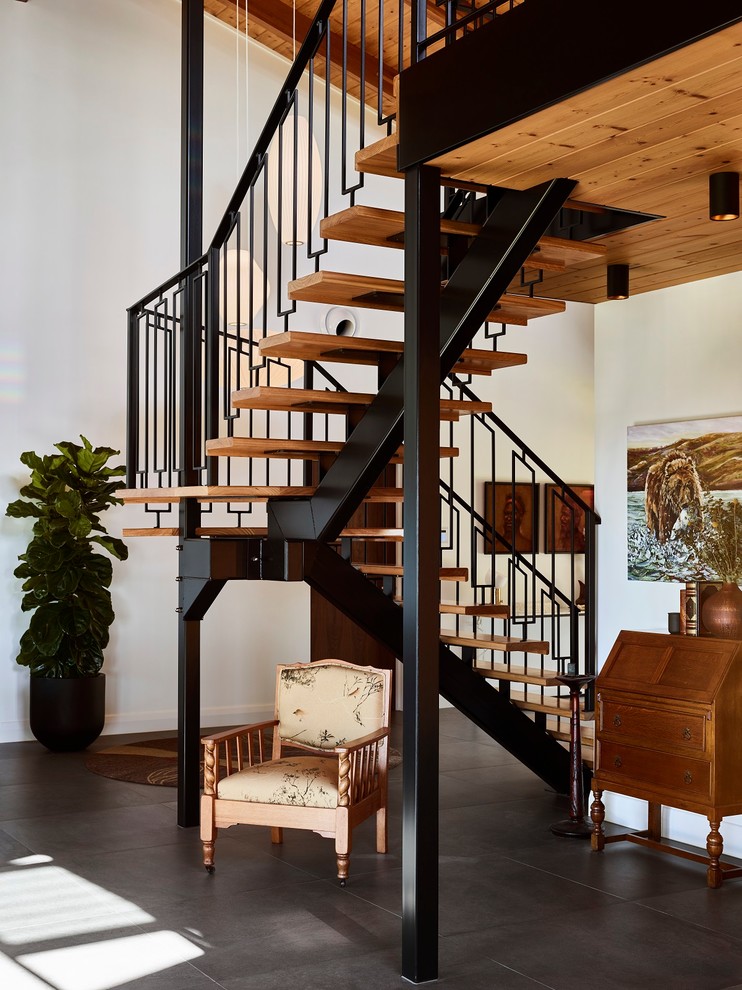 This is an example of a contemporary wood l-shaped staircase in Brisbane with open risers and metal railing.