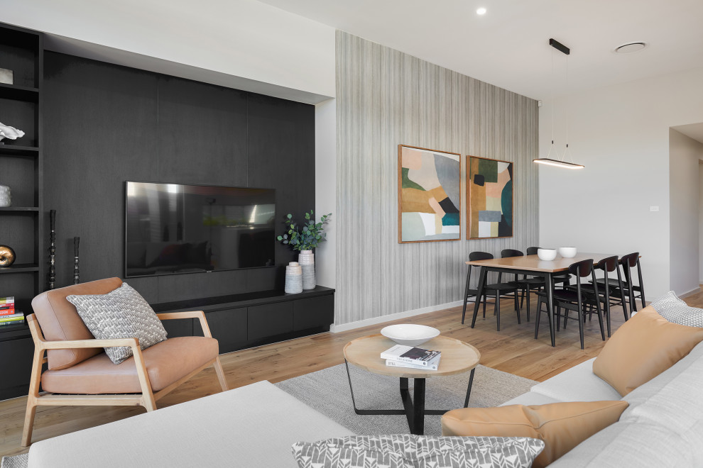 Design ideas for a mid-sized contemporary open concept family room in Sydney with no fireplace, a wall-mounted tv and wood.