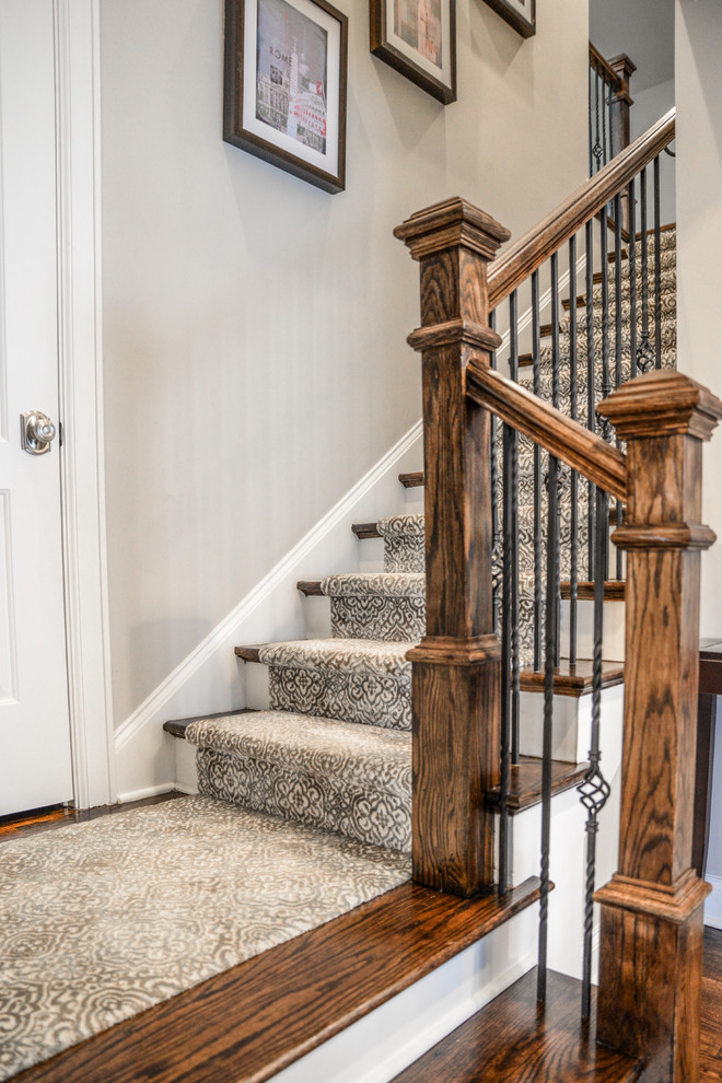 Design ideas for a mid-sized traditional carpeted l-shaped staircase in Charlotte with carpet risers and mixed railing.