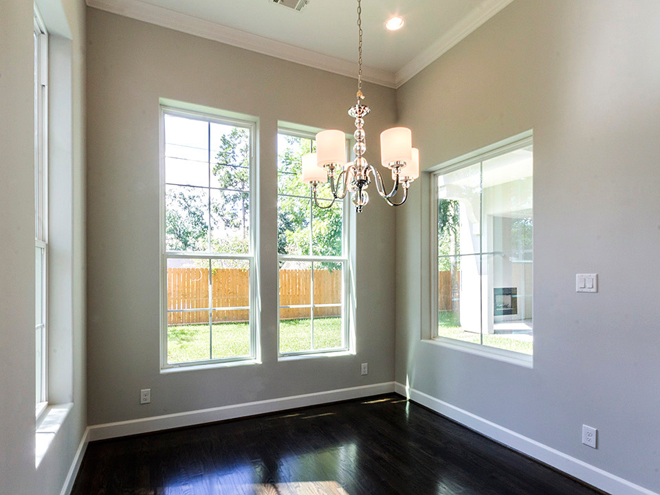 Inspiration for a mid-sized transitional dark wood floor enclosed dining room remodel in Houston with gray walls and no fireplace