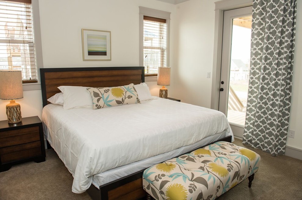 Example of a mid-sized transitional guest carpeted bedroom design with white walls and no fireplace