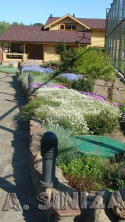 the house on the terraces with a pond near Moscow. The area 5000 sq m